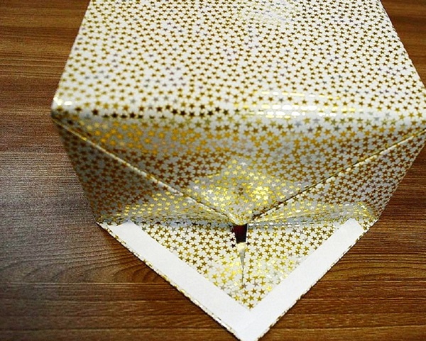 Hur man packar en present i en presentpapper